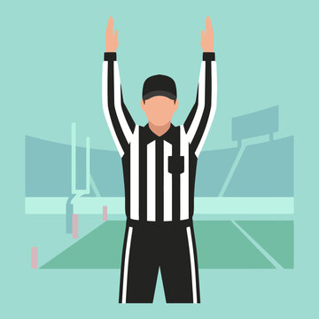 A sports official signals a touchdown on a green field