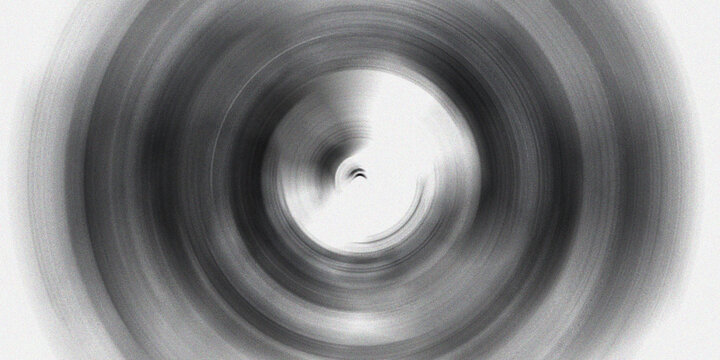 Intense dark circular motion blur background with heavy grain texture and high contrast black and white concentric ring patterns.