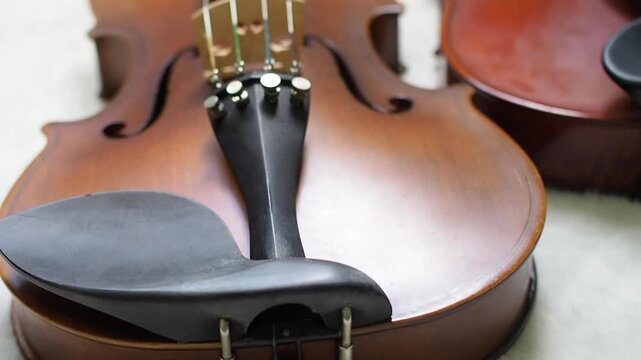 footage Beautiful Wooden violin and blurrd bow ,show detail of acoustic instrument,