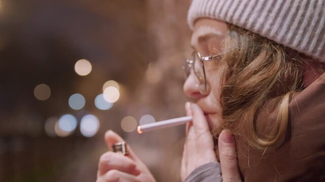 Frosty evening brings peaceful outdoor serenity. Woman stands outside embracing cold winter night atmosphere. Youthful female enjoys tranquil moments beneath chilly winter night sky outside