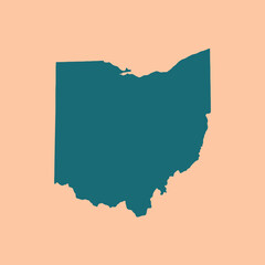 A dark teal silhouette of a geographic region on peach background © Nico