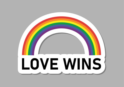 Arco&iacute;ris con la frase love wins en la parte inferior con un borde blanco sobre un fondo gris