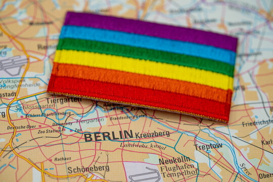 Close up of Berlin map with rainbow pride flag.