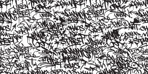Seamless graffiti pattern background featuring urban street art style tags with monochrome black spray paint on white wall. © SaHeD