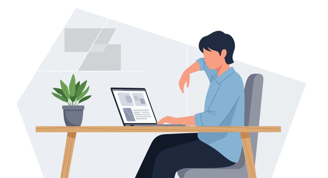 Man sitting at desk with laptop.