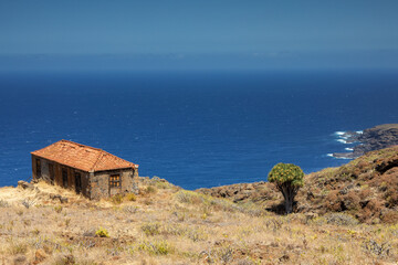 Rustic Stone House and Canary Island Dragon Tree Overlooking the Atlantic Ocean on La Palma Island © Circumnavigation
