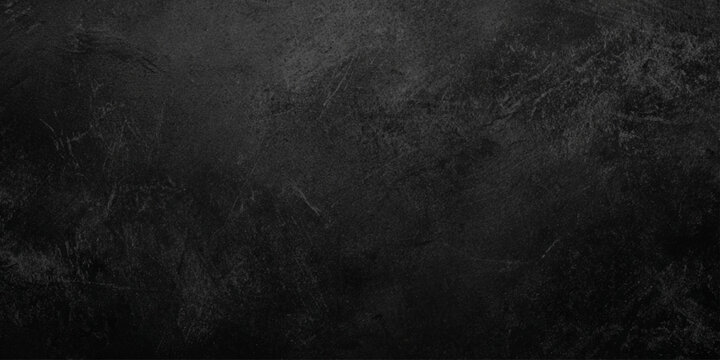 Dark gray wall or black stone texture background with rough surface and subtle gradient effect for design and decoration