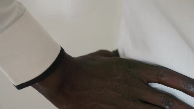 Soft hands offer calming reassurance before meeting. Actor employs tender touch to reduce tension prior to encounter. Calming gestures with gentle hands help relax nerves before important date