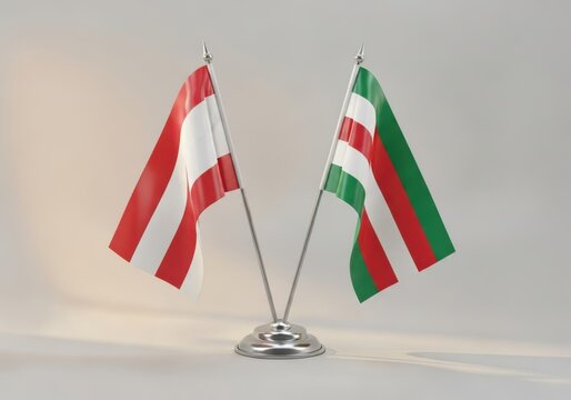 Two miniature table flags of austria and the chechen republic of ichkeria on a silver stand