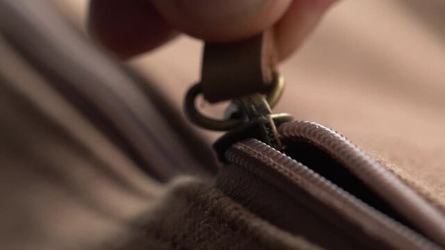 Macro view of a brown bag's zipper, retro style