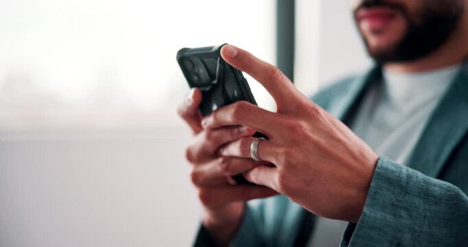 Businessman, hands and typing in office with phone, text message and social media post on work break. Space, person and scroll in agency with tech, mobile app notification or browsing for online news