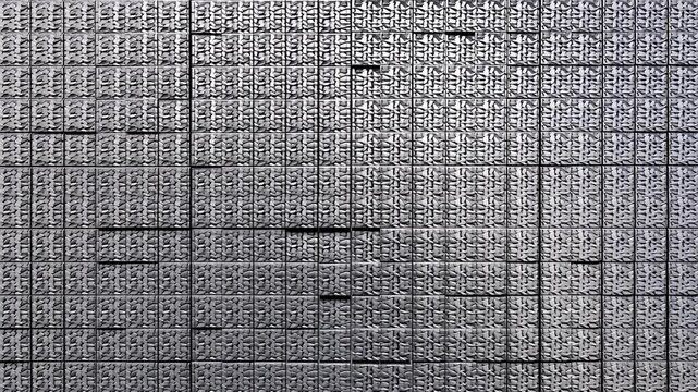 白い空間から順番に出現し画面を埋め尽くす鎖帷子模様のチタン製ブロックの背景映像