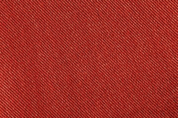 Fototapeta premium Close up background of red denim fabric texture with diagonal pattern