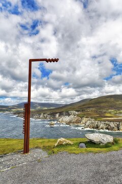 Wavy logo marks viewpoint, Irish coastal road Wild Atlantic Way, WAW, Ashleam Bay, panoramic Atlantic Drive, southern Achill Island, Mayo, Ireland