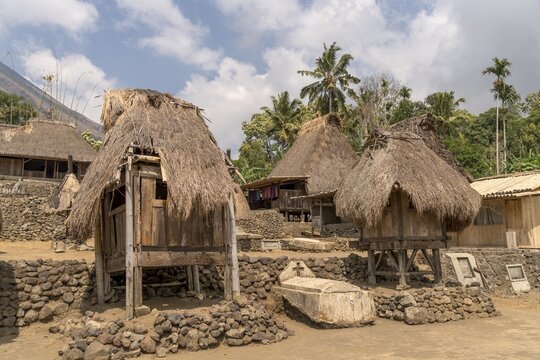 Village square with grave, shrines and traditional thatched wooden houses, Ngada village Bena, Bajawa, Flores Island, Indonesia