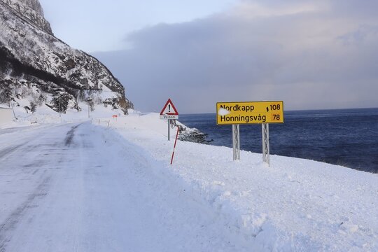 The snow-covered main road E69 on Porsangerfjord, Finnmark County, Norway
