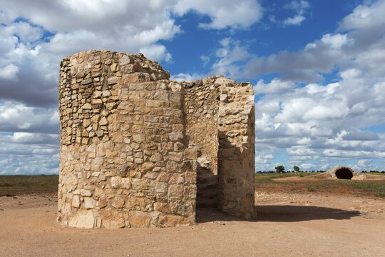 An old wall-like ruin of stones under a cloudy sky, Molino Casta&ntilde;o, Casta&ntilde;o Mill, Campo de Criptana, Ciudad Real province, Castilla-La Mancha, Don Quixote Route, Spain