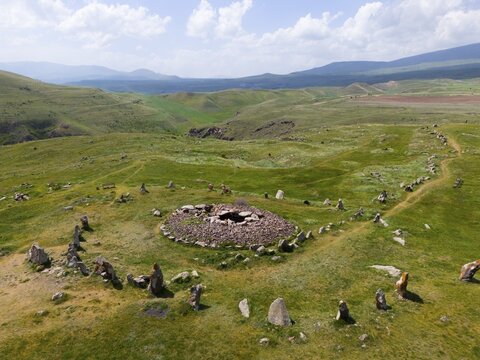 Hilly landscape with stone circle and extensive sky with clouds, aerial view, megaliths, Zorats Karer, Zorakarer, Karahundsch, Bronze Age cemetery, Sisian, Sissian, province of Syunik, historically Sangesur, Armenia