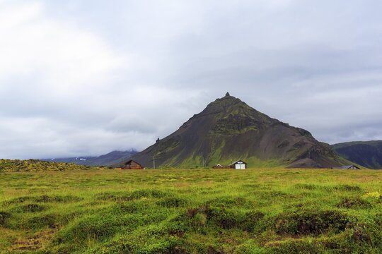 Cone-shaped mountain Stapafell, rain clouds, Arnarstapi, Faxafloi, Sn&aelig;fellsnes peninsula, Snaefellsnes, West Iceland, Iceland
