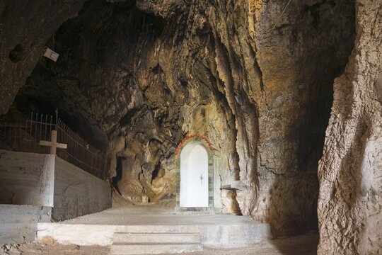 Entrance to cave with play of light, striking rock formation and steps, Church of Mary the Fountain of Life, Zoodochos Pigi, rock church, Kefalari, Argolis, Peloponnese, Greece