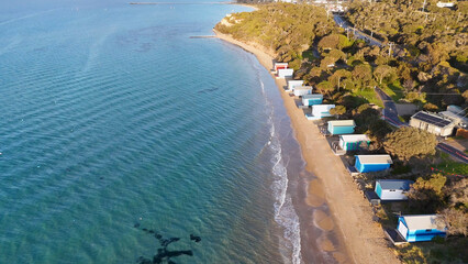Obraz premium Aerial View of Colorful Beach Huts Along the Rye Shoreline in Australia