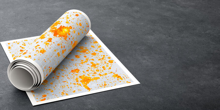Smart city map rolled on concrete surface showing orange data clusters and urban planning details