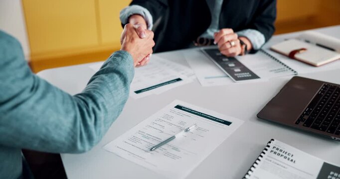 Documents, signature and business people in office with handshake for finance deal or partnership. Meeting, proposal and financial manager shaking hands with investor for contract with paperwork.