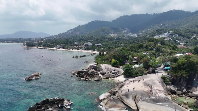 Aerial Close Orbit Around Hin Ta Hin Yai Rocks Revealing Lamai Beach Koh Samui Thailand