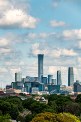 Naklejka premium Daytime view of the Beijing CBD skyline featuring modern skyscrapers under beautiful blue sky in Beijing