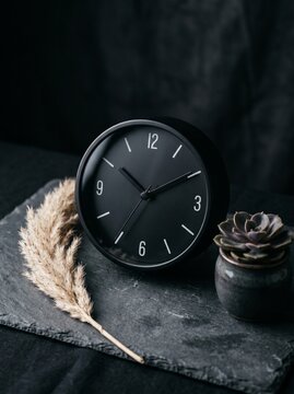 Close up shot of a minimalist clock face with sleek hands, conceptual time management and business deadline design