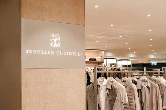 Brunello Cucinelli Luxury Boutique Interior With Neutral Menswear Display and Illuminated Brand Sign  Milan Italy May 14, 2026	