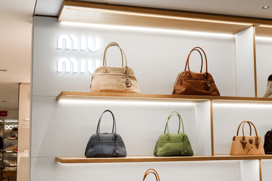 Luxury Miu Miu Handbags and Accessories Displayed in Upscale Department Store Boutique Retail Interior Milan Italy May 14, 2026	
