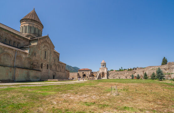 Svetitskhoveli Cathedral stands under a clear blue sky in Mtskheta