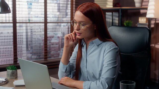 Serious Caucasian business woman working typing laptop thinking using cyberspace at table pensive businesswoman girl female work with computer agent think deciding internet job hesitate in office