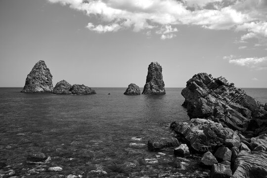 Rocky islet on the Cyclops coast on the island of Sicily