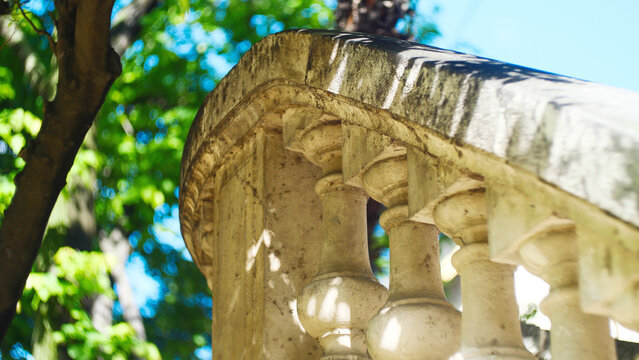 Classical stone balustrade with concrete balusters in the historic old town. Architectural background with classic decorative railing structure on an ancient European building terrace or balcony.