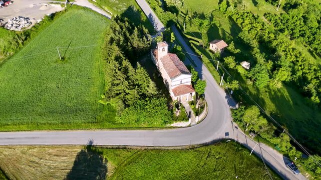 Aerial Orbit of a Rural Church and Winding Road in Piedmont