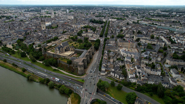  Aerial view beside the old town above the city Angers in France, on a cloudy noon in early summer.