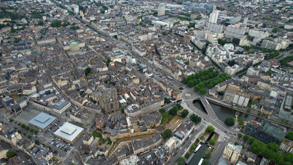 Obraz premium Aerial view beside the old town above the city Rennes in France, on a cloudy noon in early summer.