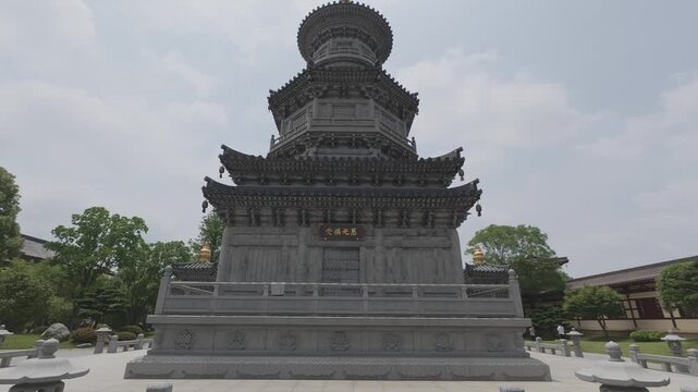 4K resolution cinematic tilt up shot of the traditional stone carved pagoda named "Guangming" (Light) at Donglin Temple, Jiujiang, shot in ProRes Log format.
