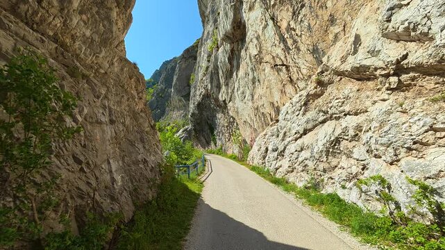 Narrow road winds between towering cliffs. Ovcar Kablar Gorge. Balkans, Serbia