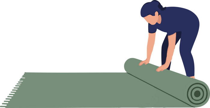 Person carefully rolling out green carpet or rug indoors.