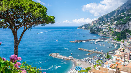 Naklejka premium Amalfi town on Amalfi Coast viewed from above with harbor and marina, Mediterranean Sea, sunny summer travel destination concept