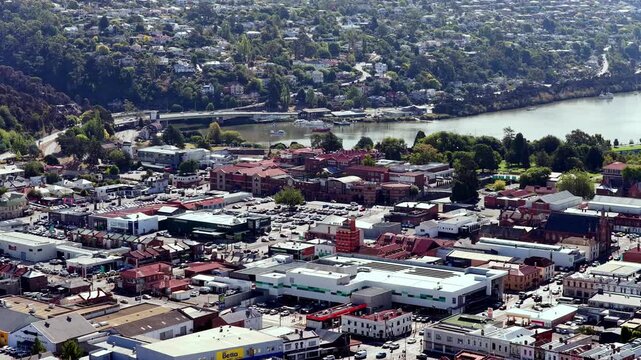 Mid aerial panorama of Launceston city downtown on Esk river waterfront &ndash; Tasmanian culture.