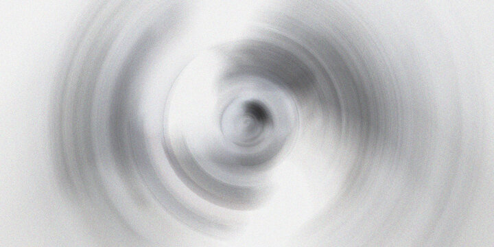 Swirling vortex abstract background with radial motion blur effect creating circular monochromatic pattern for creative art.
