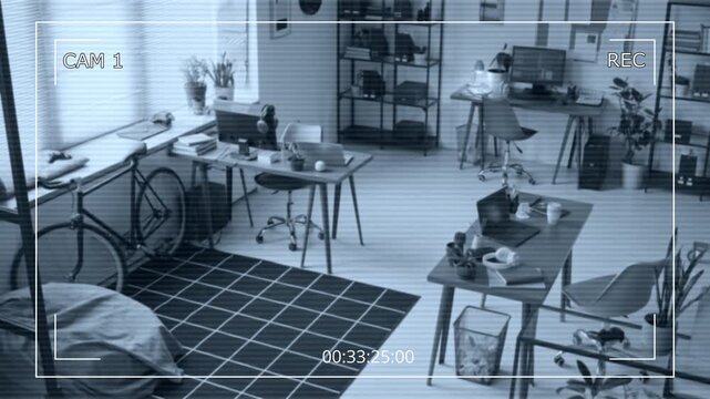 No people CCTV filmed by surveillance camera of cozy office of tech startup, featuring computers with code on desks, bicycle by wall, carpet and bean bag chair for employee comfort and productive work