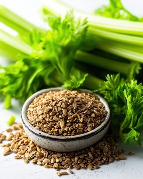 A bowl of cumin seeds surrounded by fresh green celery, showcasing vibrant colors and natural textures.