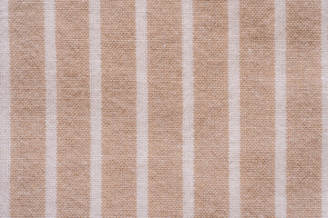 Fototapeta premium Beige striped fabric texture in close up.