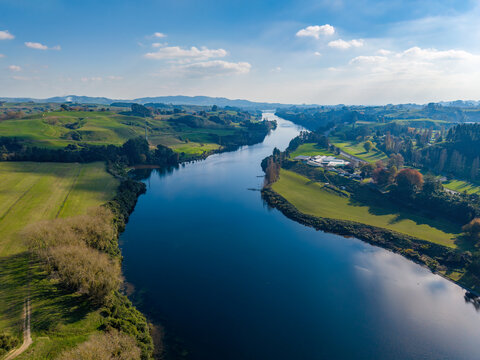 Lake Karapiro, a man-made lake on the Waikato River, winds gracefully through a rural landscape. Aerial view