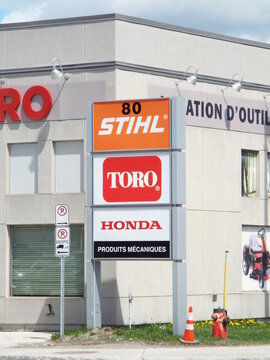 Gatineau, Quebec, Canada &ndash; May 7, 2026: A roadside commercial sign features branding logos for "Stihl, Toro, and Honda power equipment" outside a tool rental building at 80 boulevard Saint-Raymond.